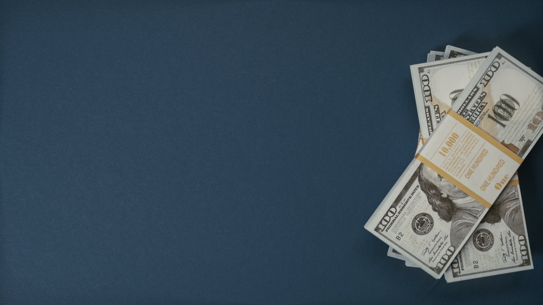 dollars on blue surface