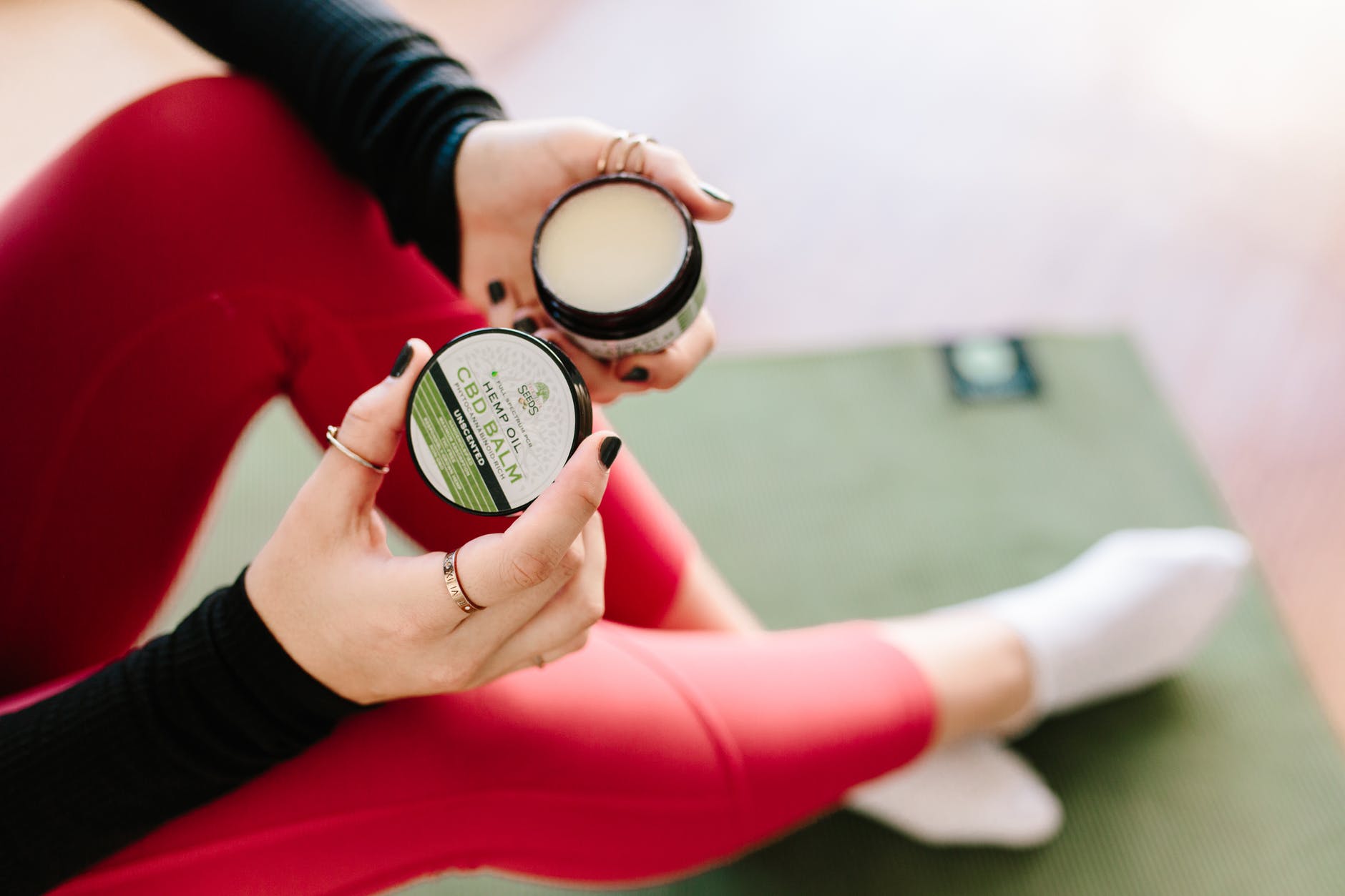 woman using cbd balm