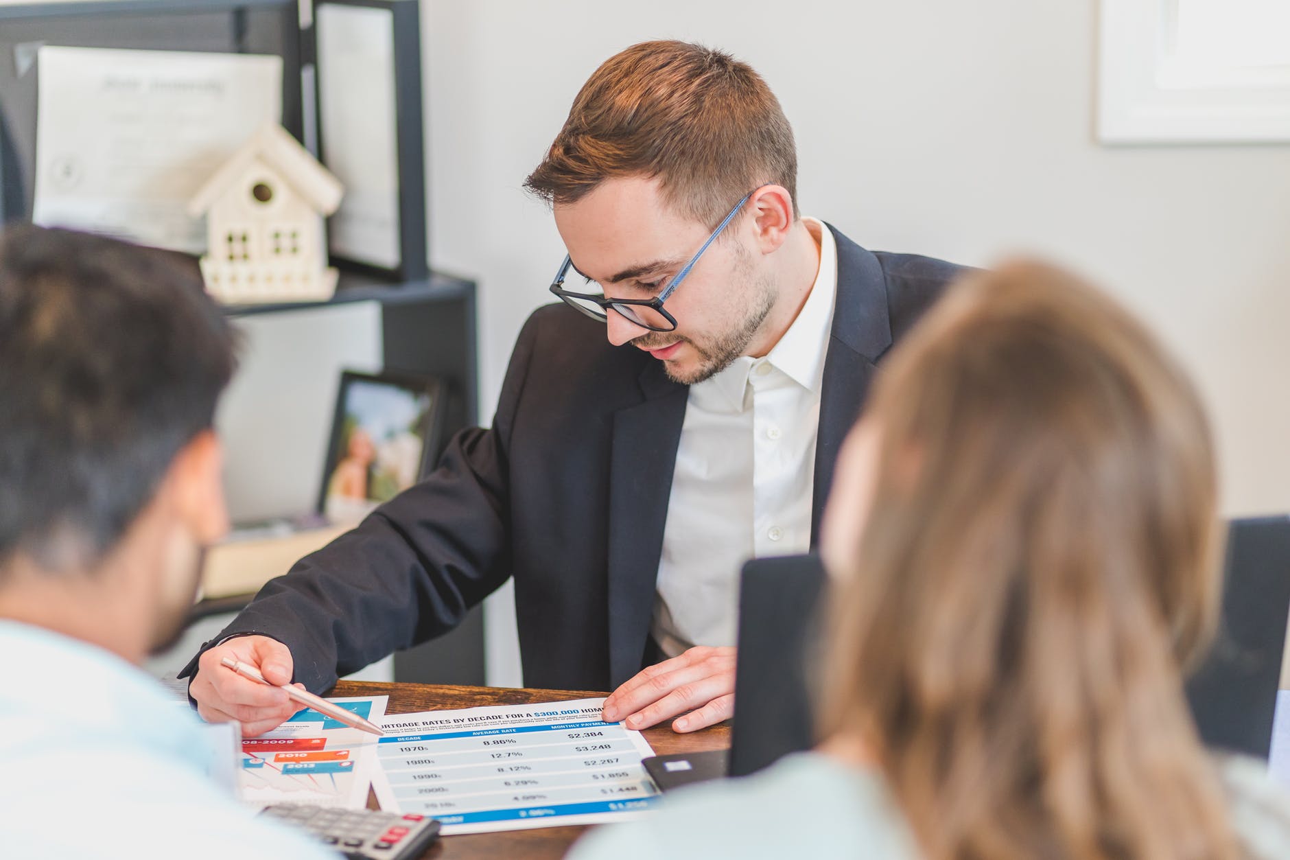 real estate agent discussing in front of his client