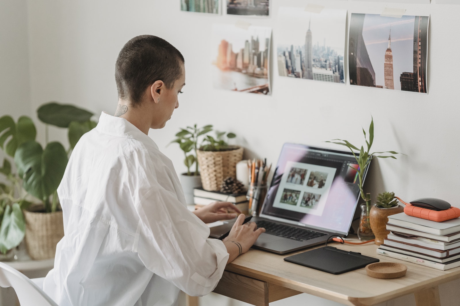 Focused woman working on laptop at desk