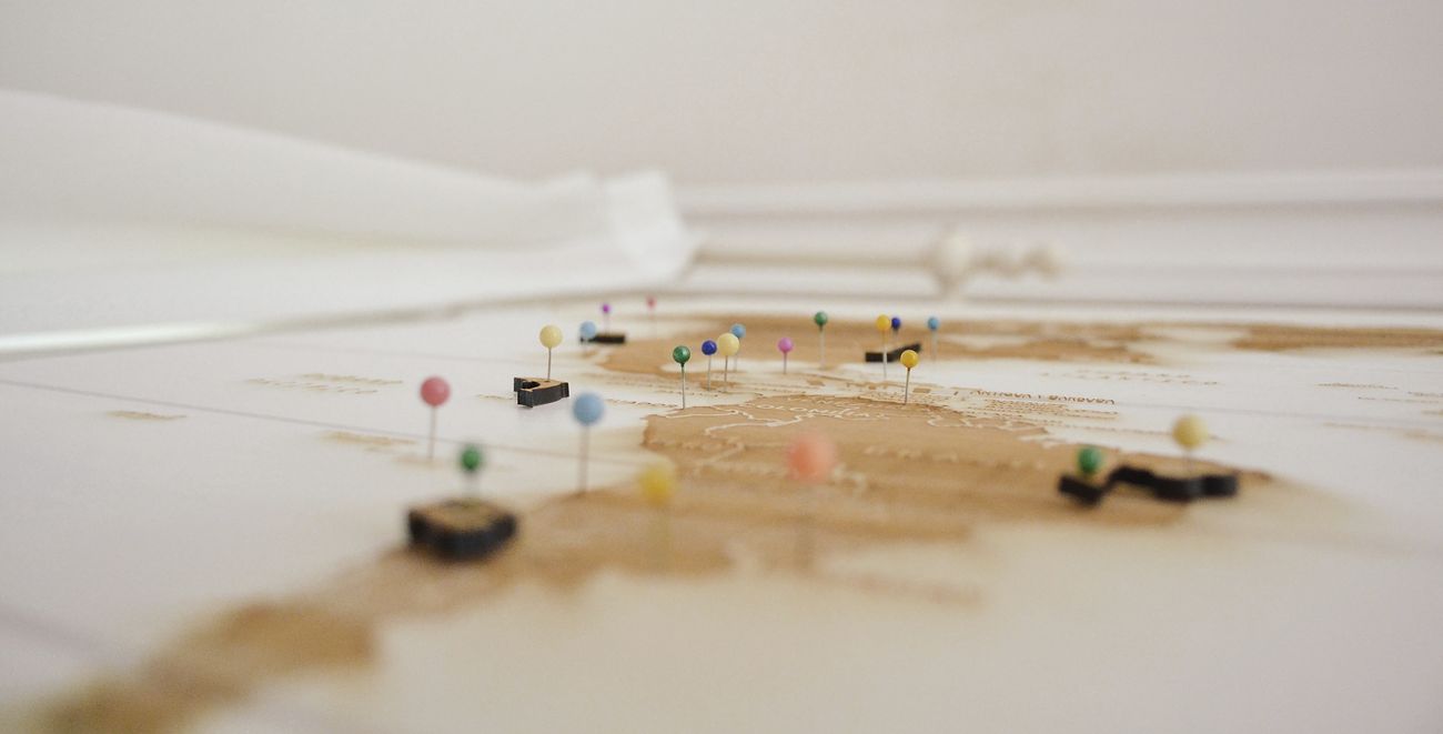 Close-up of colorful pins in a world