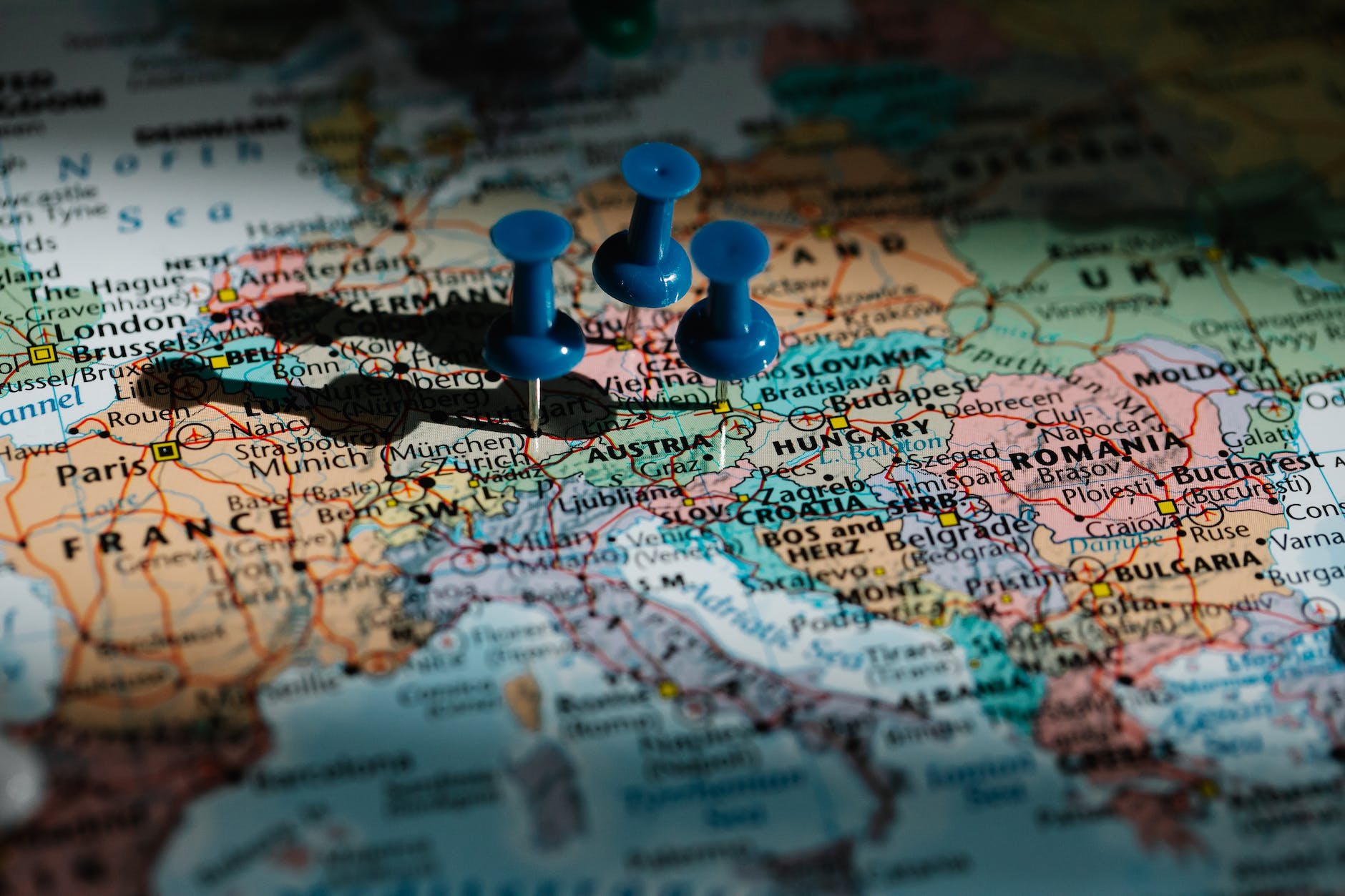 blue pushpins on administrative map of europe
