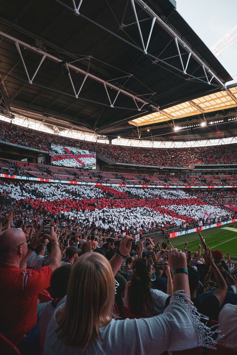 People in Stadium Watching a Game