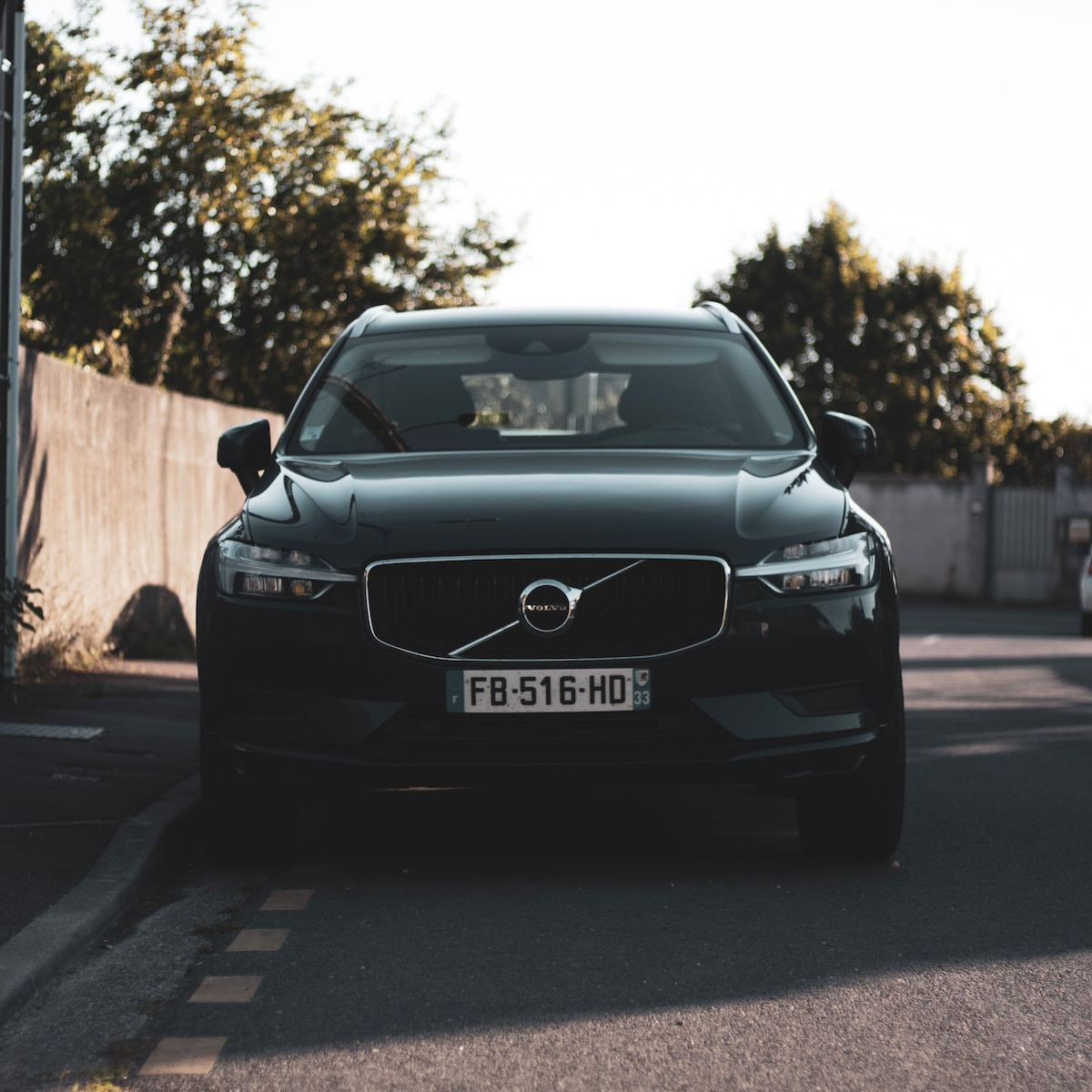 black mercedes benz c class on road during daytime