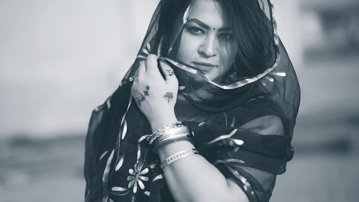 a woman with a scarf around her neck