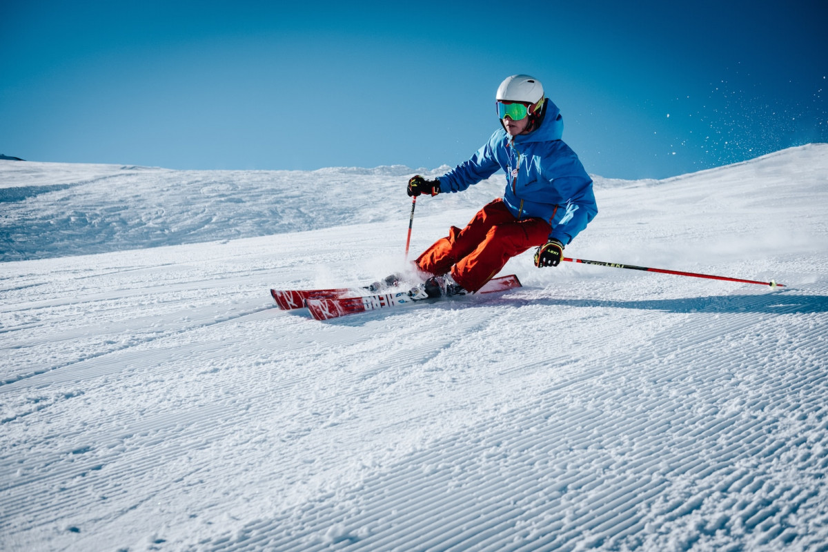 man ice skiing on hill. Skiing API